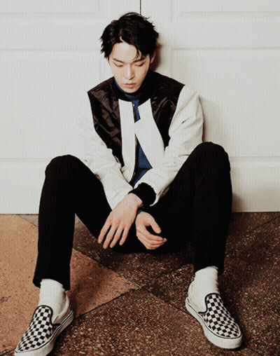 Man Sitting On Floor In Black And White Checkered Shoe GIF