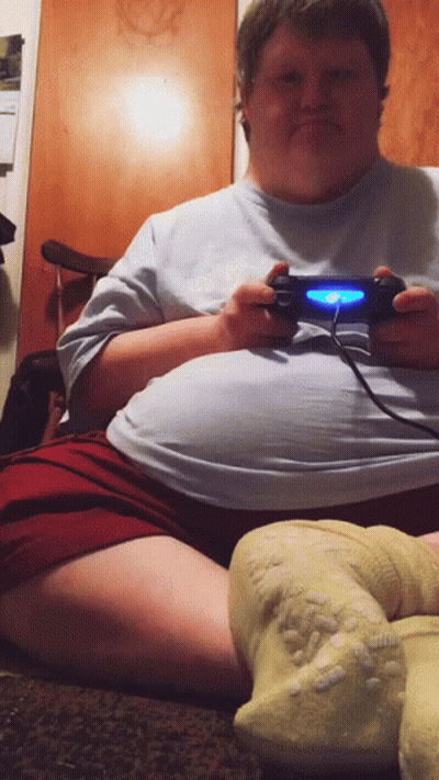 Man Sitting On Floor Playing Video Game GIF
