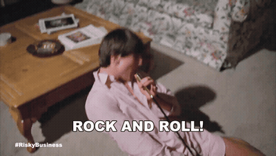Man Sitting On Floor Saying Rock And Roll GIF