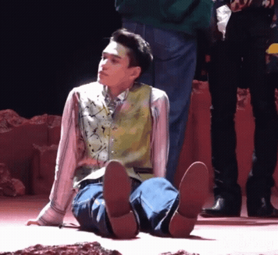 Man Sitting On Floor With Feet Up GIF