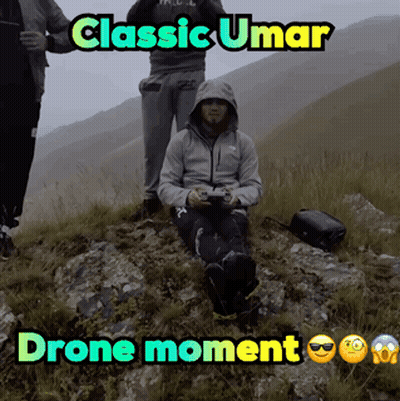 Man Sitting On Hill Saying Classic Umar Drone Moment GIF
