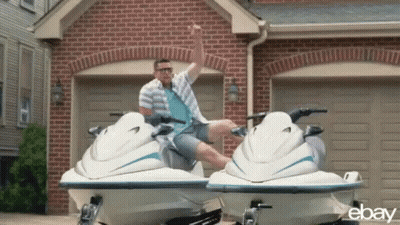 Man Sitting On Jet Ski In Front Of Garage GIF
