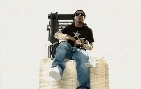 Man Sitting On Pile Of Money GIF