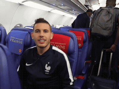 Man Sitting On Plane In Nike Jacket Saying France GIF