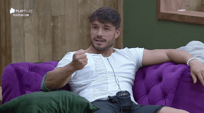 Man Sitting On Purple Couch With Playplus GIF