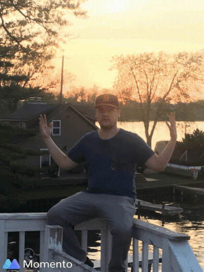 Man Sitting On Railing Saying Momento GIF