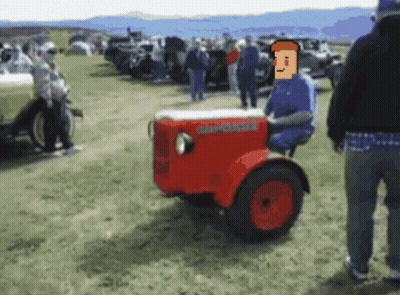 Man Sitting On Red Johnson Tractor GIF