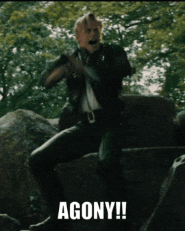 Man Sitting On Rock In Agony GIF