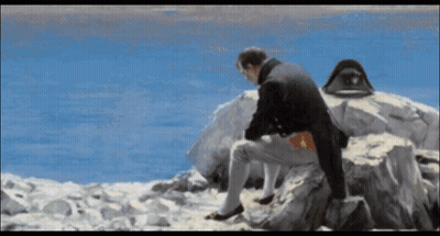 Man Sitting On Rock Near Ocean GIF