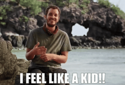 Man Sitting On Rock Saying I Feel Like A Kid GIF