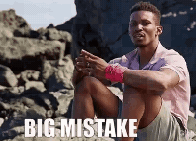 Man Sitting On Rocky Beach Saying Big Mistake GIF