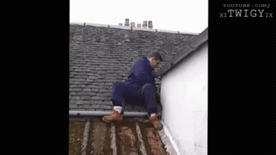Man Sitting On Roof Edge Looking Down GIF