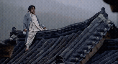 Man Sitting On Roof With Bottle GIF