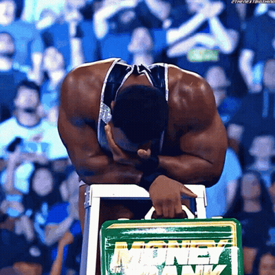 Man Sitting On Stool Holding Green Money Bank GIF