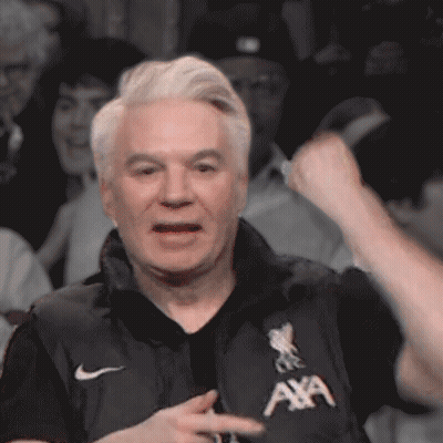 Man Sitting On Stool Holding Microphone GIF