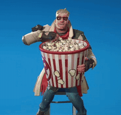 Man Sitting On Stool Holding Popcorn Bucket GIF