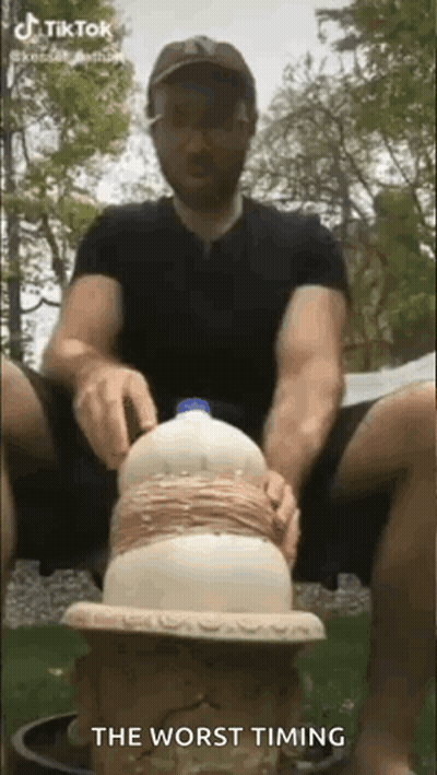 Man Sitting On Stool With Bottle Of Milk GIF