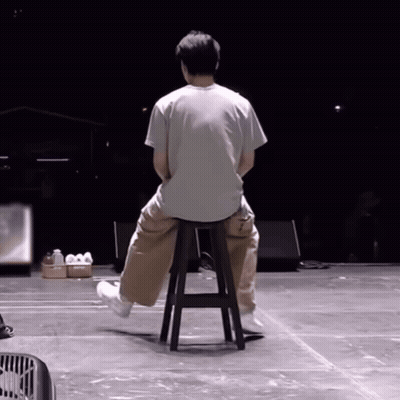 Man Sitting On Stool With Crossed Legs GIF