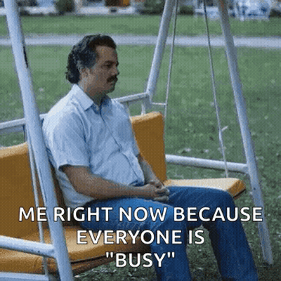 Man Sitting On Swing In Park GIF