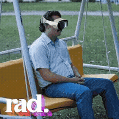 Man Sitting On Swing Wearing VR Headset GIF