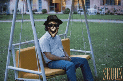 Man Sitting On Swing With Skull GIF