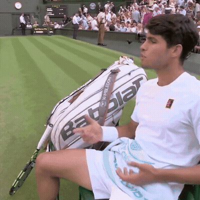 Man Sitting On Tennis Court With Babolat Bag GIF