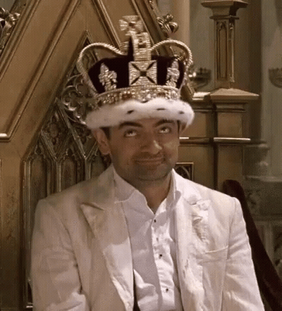Man Sitting On Throne In Crown And White Jacket GIF