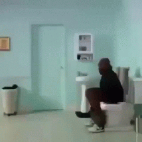 Man Sitting On Toilet GIF