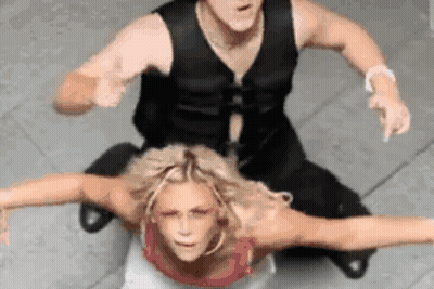 Man Sitting On Top Of Woman Pointing GIF