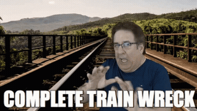 Man Sitting On Train Tracks Saying Complete Train Wreck GIF