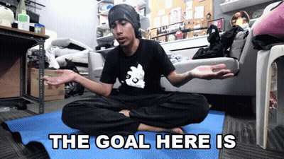 Man Sitting On Yoga Mat With Goal Text GIF