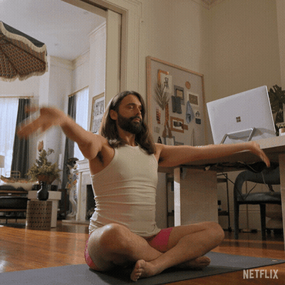 Man Sitting On Yoga Mat With Netflix Logo GIF