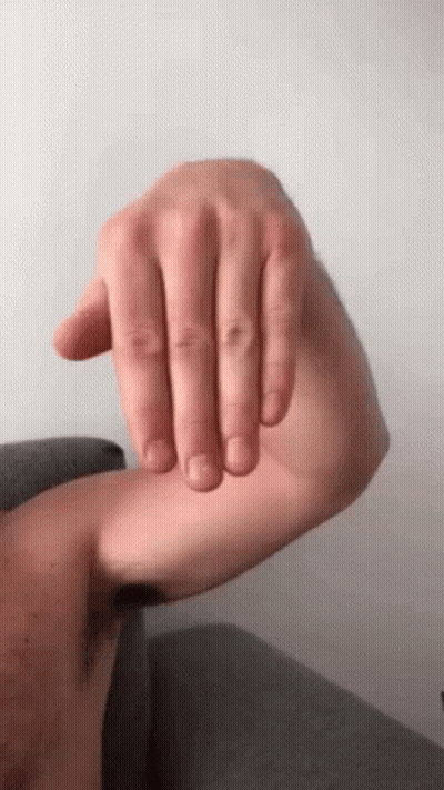 Man Sitting Shirtless On Couch GIF