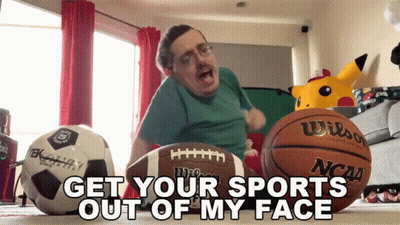 Man Sitting With Football And Basketball Saying Get Your Sports Out Of My Face GIF