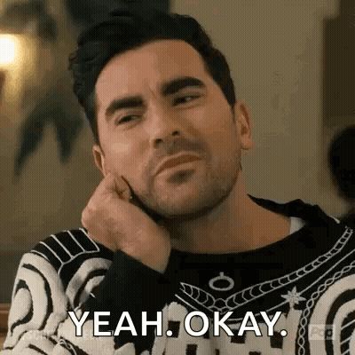 Man Sitting With Hand On Chin Saying Yeah Okay GIF
