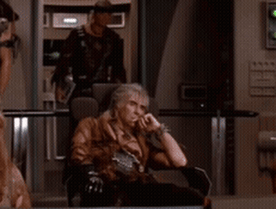 Man Sitting With Hands On Chin GIF