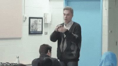 Man Sitting With Serious Expression GIF
