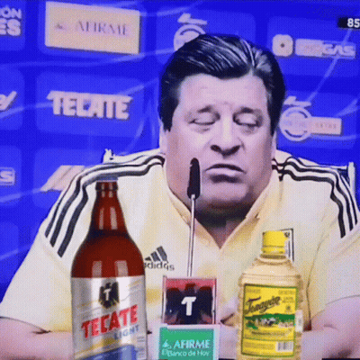 Man Sitting With Tecate Light GIF