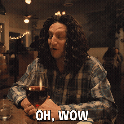 Man Sitting With Wine Saying Oh Wow GIF
