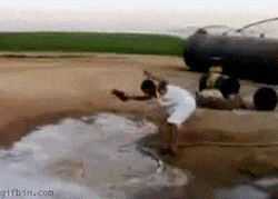 Man Slap Fire Hose Using Slippers GIF