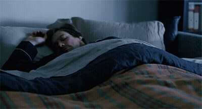 Man Sleeping In Bed With Plaid Blanket GIF