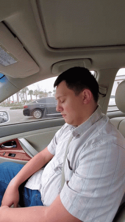 Man Sleeping In Car With Warning Label GIF