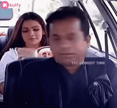 Man Sleeping While Woman Reads In Car GIF