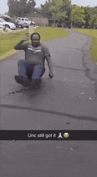Man Sliding Down Road Saying Unc Still Got It GIF