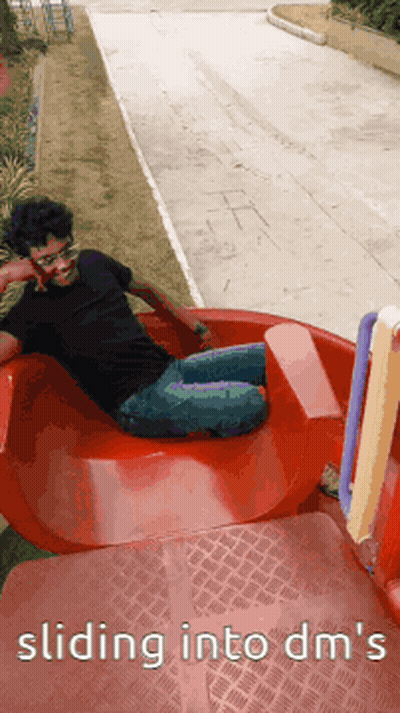 Man Sliding Down Slide Saying Sliding Into DMs GIF