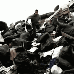 Man Sliding In Garbage Dump GIF