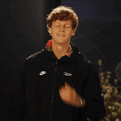 Man Smiling Adjusting Black Nike Jacket GIF