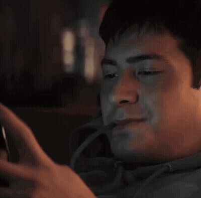 Man Smiling At Cell Phone GIF