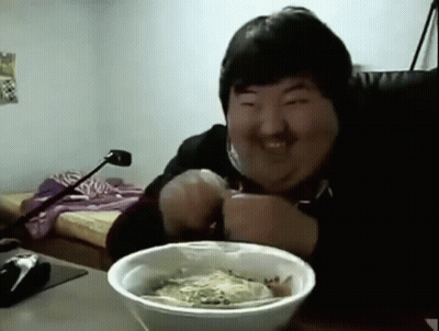 Man Smiling At Table With Bowl Of Food GIF