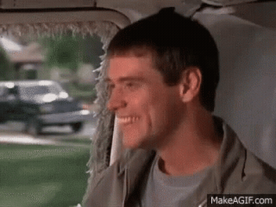 Man Smiling Back Seat Of Car Looking Out Window GIF
